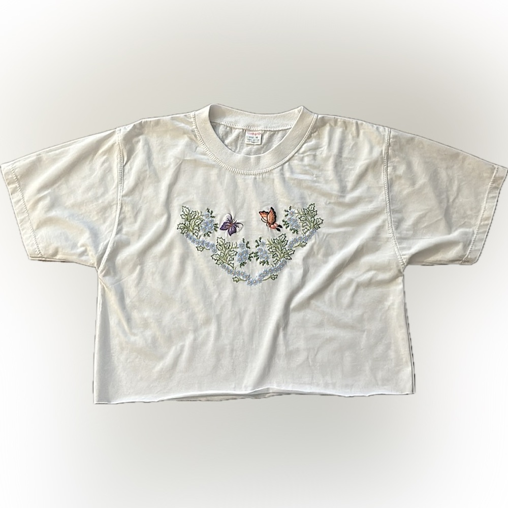 A cropped t-shirt with adorable hand embroidery deisgn